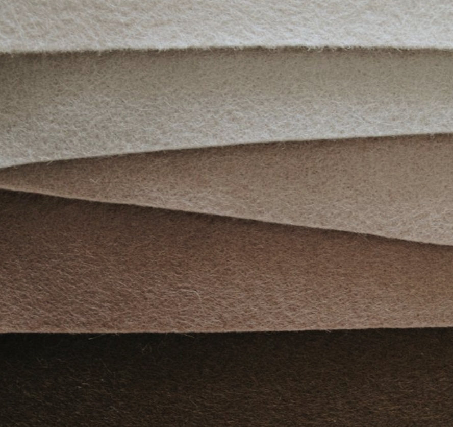 Layers of recycled felt in warm neutral colors